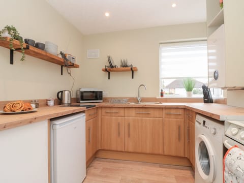 Fridge, electric kettle, cookware/dishes/utensils