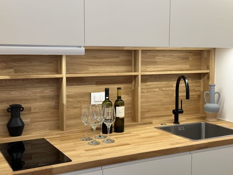 Mini-fridge, microwave, stovetop, cookware/dishes/utensils