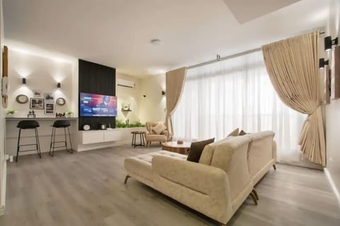Luxury Apartment | Living area | 52-cm Smart TV with cable channels, Netflix, Hulu