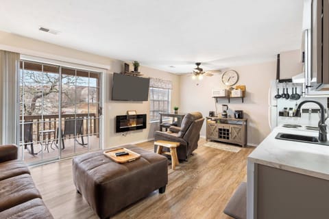 Condo, 1 King Bed with Sofa bed, Balcony (Chandler’s Pondview Getaway) | Living area | 42-inch flat-screen TV with digital channels, fireplace