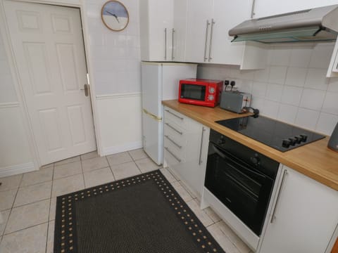 Fridge, electric kettle, cookware/dishes/utensils