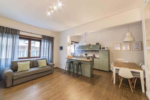 Comfort Apartment, 4 Bedrooms | Living area | 55-inch LED TV with digital channels