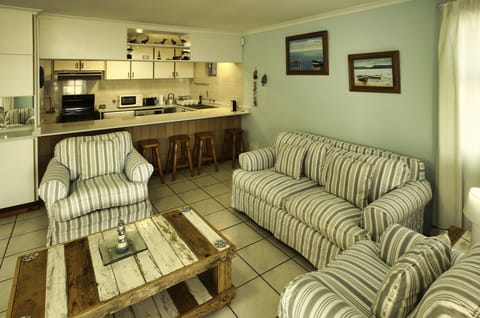 Comfort House | Living area | 42-inch flat-screen TV with satellite channels