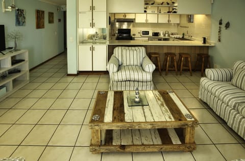 Comfort House | Living area | 42-inch flat-screen TV with satellite channels