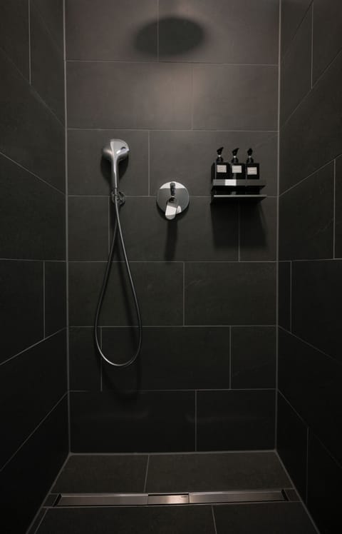 Shower, rainfall showerhead, hair dryer, towels