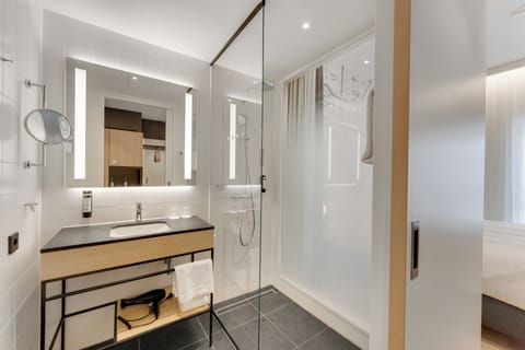 Shower, rainfall showerhead, hair dryer, towels