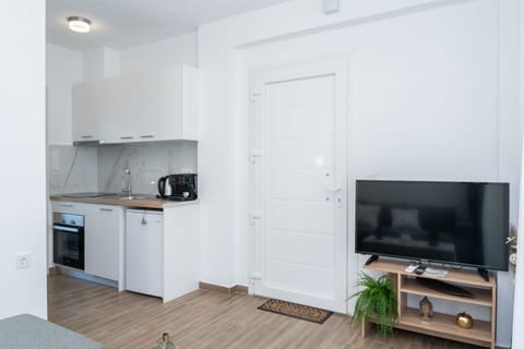 Apartment, 1 Bedroom | Living area | 40-inch flat-screen TV with cable channels