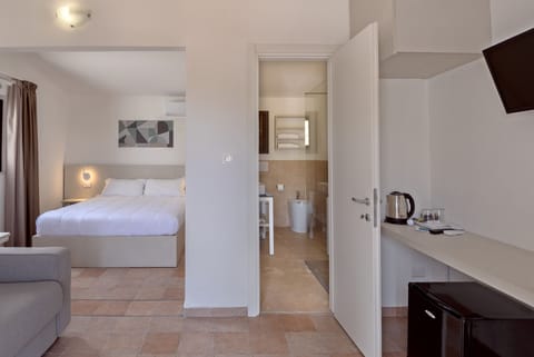 Premium bedding, desk, laptop workspace, blackout drapes