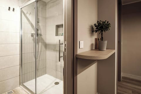 Deluxe Suite, 2 Bedrooms, City View | Bathroom | Shower, free toiletries, hair dryer, towels