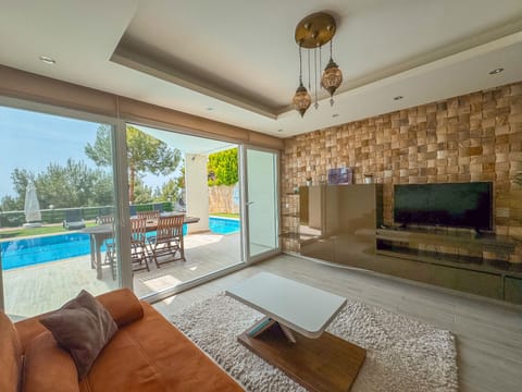Exclusive Villa | Living area | 40-inch LCD TV with satellite channels