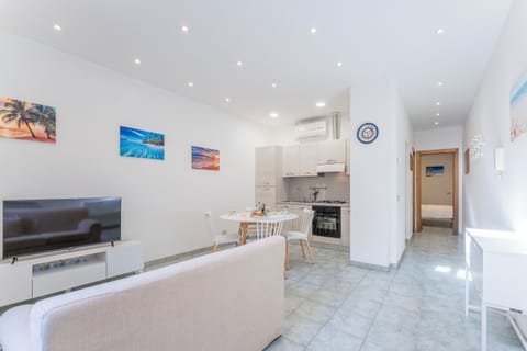 Apartment, City View | Living area | 32-inch flat-screen TV with satellite channels