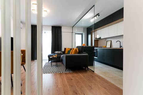 Superior Apartment, Balcony | Living area | 60-cm Smart TV with cable channels, Netflix, streaming services