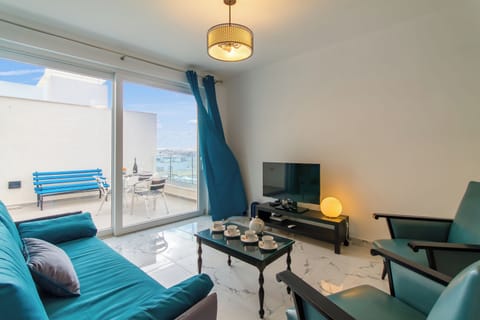 Family Apartment, Multiple Bedrooms, 2 Bathrooms (A Sunny Penthouse Modern 2 bdr -) | Living area | 21-inch flat-screen TV with digital channels