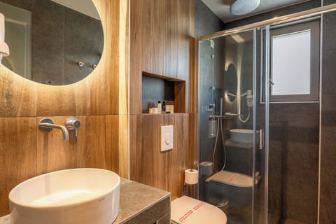 Shower, hair dryer, slippers, towels