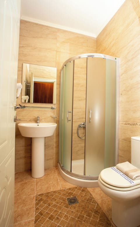 Shower, free toiletries, hair dryer, slippers