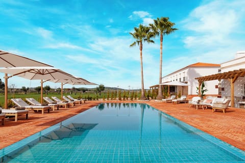 Outdoor pool, pool umbrellas, sun loungers