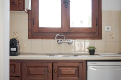 Fridge, stovetop, espresso maker, coffee/tea maker