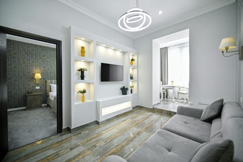 Apartment | Living area | 55-inch LCD TV with satellite channels