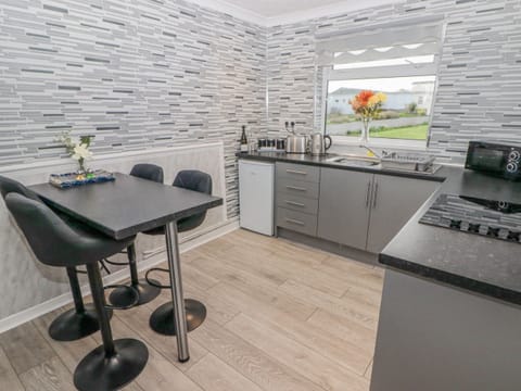 Fridge, electric kettle, toaster, cookware/dishes/utensils