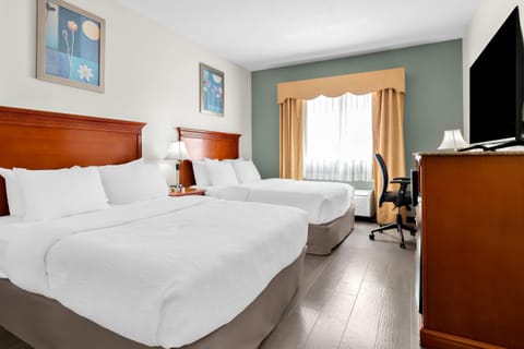 Premium bedding, down comforters, desk, laptop workspace