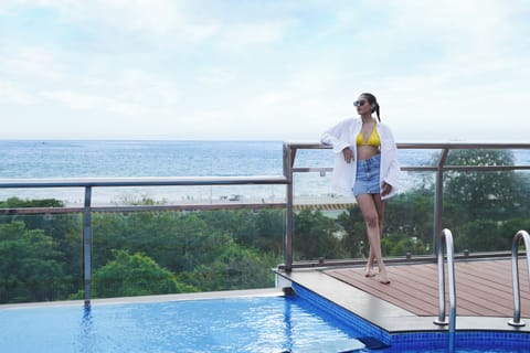 Outdoor pool, open 7:00 AM to 7:00 PM, pool umbrellas