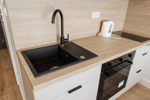 Fridge, stovetop, electric kettle, cookware/dishes/utensils