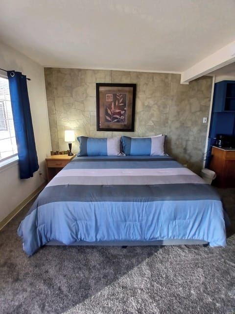 Single King Standard | Premium bedding, pillowtop beds, blackout drapes, iron/ironing board