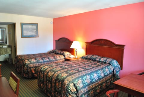 Pillowtop beds, desk, blackout drapes, iron/ironing board