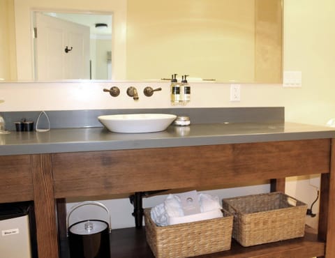 Combined shower/tub, designer toiletries, hair dryer, bathrobes