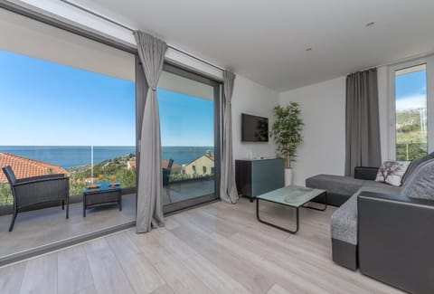 Villa, Sea View | Living area | Flat-screen TV