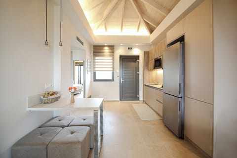 Deluxe Apartment, Sea View | Living area | TV