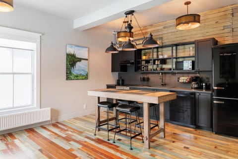 Suite, 1 Queen Bed | Private kitchen | Full-size fridge, microwave, dishwasher, coffee/tea maker