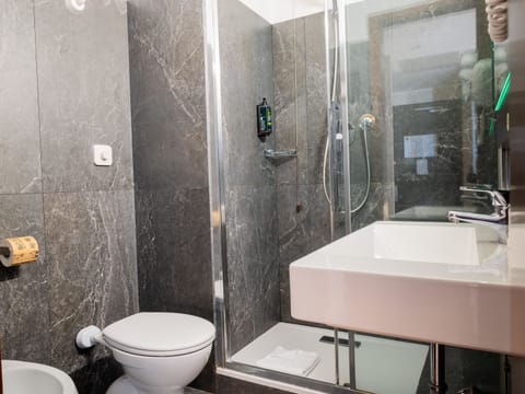 Twin Room | Bathroom | Shower, hair dryer, bidet, towels