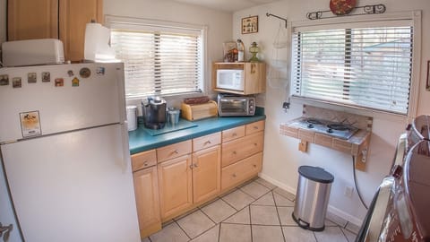 Design Cottage, Kitchenette, Mountain View | Private kitchenette | Dishwasher, cookware/dishes/utensils