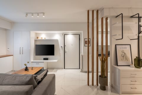 City Apartment | Living area | 50-inch Smart TV with cable channels