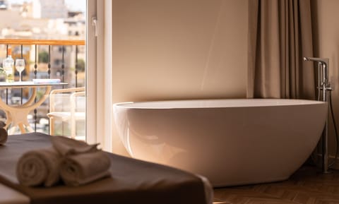 Superior Family Room, Balcony, Sea View | Deep soaking bathtub