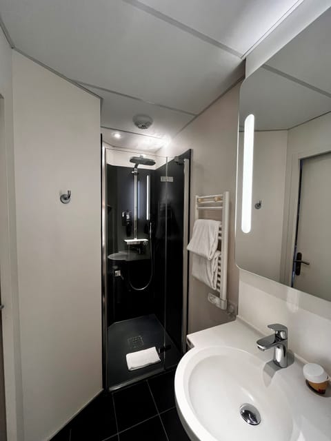 Shower, eco-friendly toiletries, hair dryer, towels