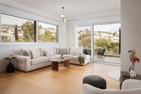 Exclusive Apartment | Living area | 55-inch Smart TV with cable channels, Netflix, streaming services