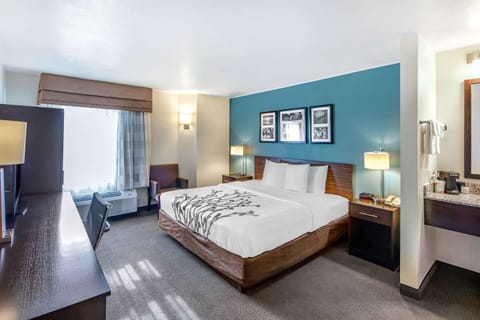 Premium bedding, desk, laptop workspace, iron/ironing board