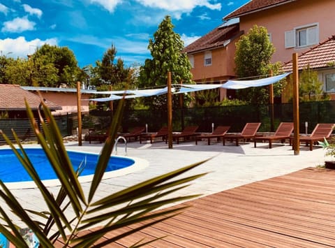 Seasonal outdoor pool, pool umbrellas, sun loungers