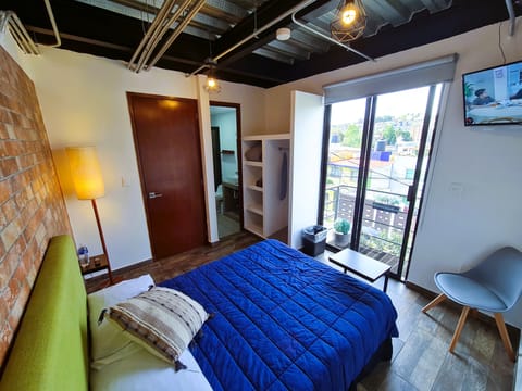 Deluxe Room, Balcony, City View | 1 bedroom, premium bedding, in-room safe, individually decorated