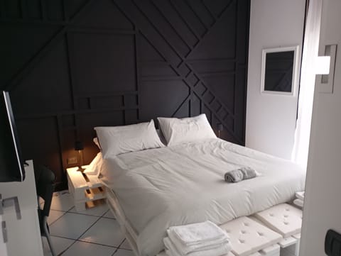 Quadruple Room, Courtyard View | Down comforters, individually decorated, individually furnished, desk