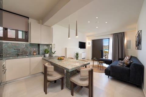 Premium Two Bedroom Suite with Partial Sea View | Living area | 40-inch flat-screen TV with cable channels