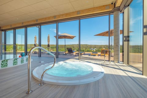 Indoor pool, pool umbrellas, sun loungers