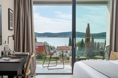 Deluxe Double Room, Balcony, Sea View | In-room safe, desk, blackout drapes, iron/ironing board