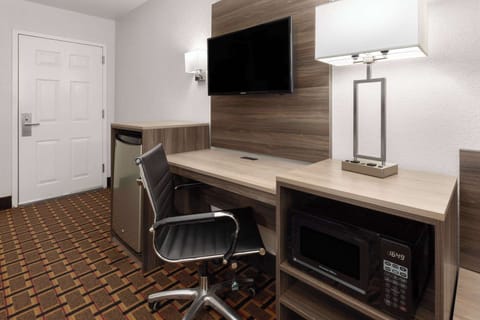 Desk, laptop workspace, blackout drapes, free cribs/infant beds