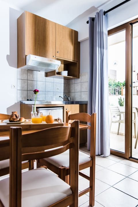 Mini-fridge, toaster, cookware/dishes/utensils, dining tables