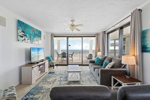 Signature Condo, 3 Bedrooms, Kitchen, Beachfront (Pelican Pointe 506) | Living room | 55-inch Smart TV with digital channels
