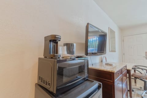 Premium bedding, desk, laptop workspace, blackout drapes