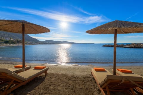 On the beach, sun loungers, beach umbrellas, beach bar